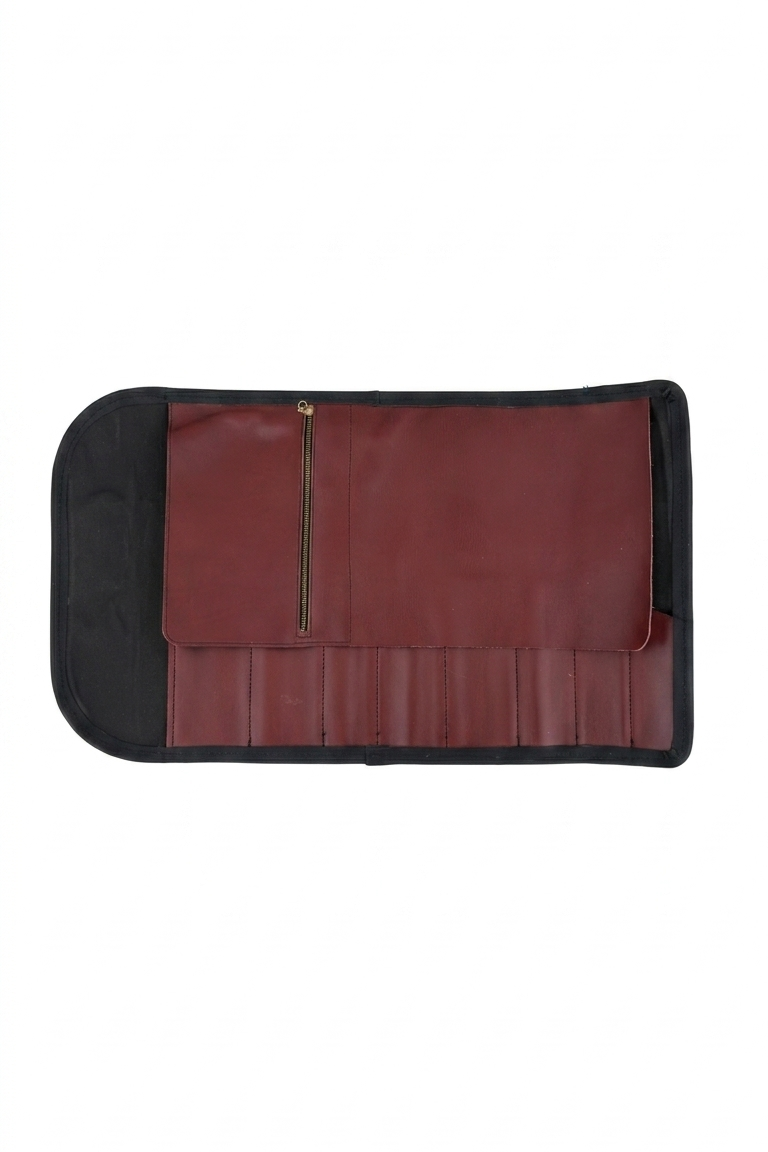 Black knife roll with a gold zipper on a white background