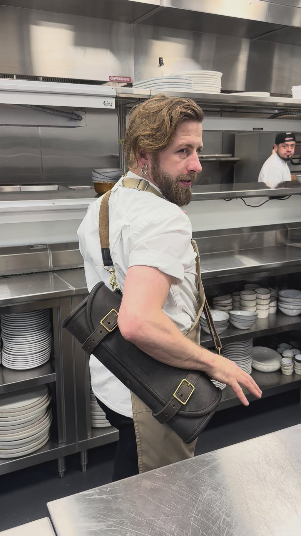 Chef Patrick holding the Heritage Roll with  shoulder strap